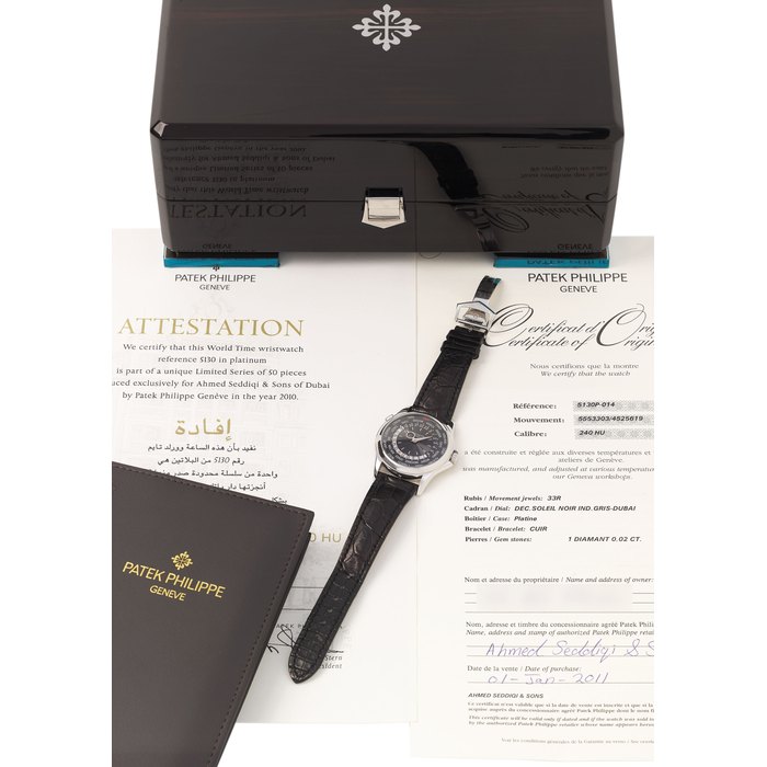 PATEK PHILIPPE. A FINE AND EXTREMELY RARE PLATINUM LIMITED EDITION DUBAI U.A.E. AUTOMATIC WORLD TIME WRISTWATCH WITH BLACK DIAL MADE FOR AHMED SEDDIQI & SONS, ORIGINAL CERTIFICATE AND BOX SIGNED PATEK PHILIPPE, GENEVE, REF. 5130P, LIMITED EDITION DUBAI TIME, MOVEMENT NO. 5’553’303, CASE NO. 4’525’619, MANUFACTURED IN 2010