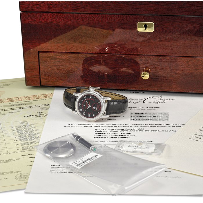 Patek Philippe. An extremely fine, unique and important platinum perpetual calendar minute repeating wristwatch with tourbillon, retrograde date, moon phases, black dial with Breguet numerals, red signature, minute and seconds scales, date and date hand, original certificate, rating accuracy certificate, original design notes, second case back, pin, sale tag, leather folder, presentation box and outer packaging Signed Patek Philippe, Genève, ref. 5016P, movement no. 1’905’103, case no. 4’326’767