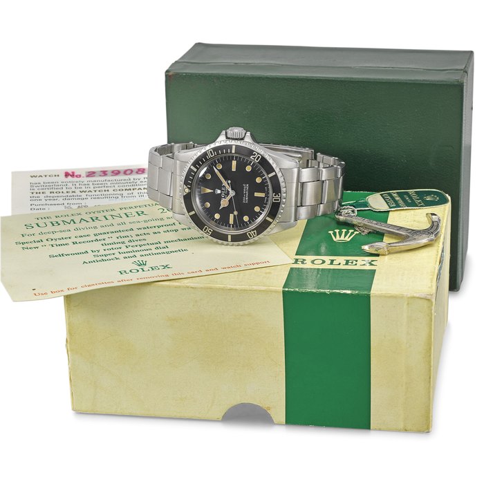 ROLEX. A RARE AND ATTRACTIVE STAINLESS STEEL AUTOMATIC WRISTWATCH WITH SWEEP CENTRE SECONDS, BLACK MATTE METERS FIRST DIAL, BRACELET, ADDITIONAL BRACELET, ROLEX OYSTER GUARANTEED 200M/660FT UNDER WATER ANCHOR, ORIGINAL GUARANTEE AND BOX SIGNED ROLEX, OYSTER PERPETUAL, 200M=660FT, SUBMARINER, REF. 5513, CASE NO. 2’390’859, CIRCA 1970