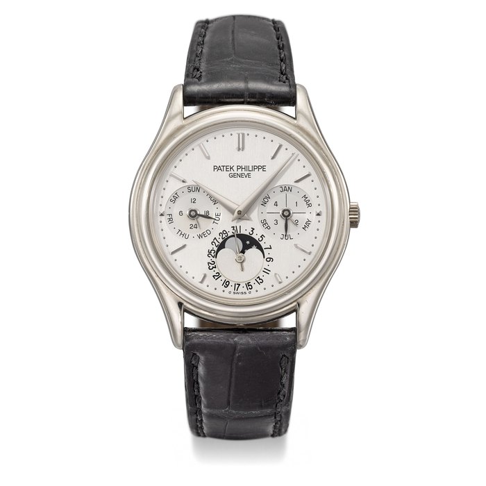 PATEK PHILIPPE. A VERY FINE AND RARE 18K WHITE GOLD AUTOMATIC PERPETUAL CALENDAR WRISTWATCH WITH MOON PHASES, DAY, DATE, MONTH AND 24 HOUR INDICATION SIGNED PATEK PHILIPPE, GENEVE, REF. 3940G-013, MOVEMENT NO. 3’127’348, CASE NO. 4’260’783, MANUFACTURED IN 2004