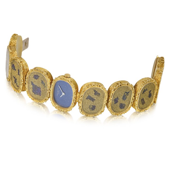 PATEK PHILIPPE. A VERY RARE AND ELEGANT 18K WHITE AND YELLOW WRISTWATCH WITH BLUE DIAL, BRONZE POWDER AND CHALCOPPYRITE BUTTERFLY WING MOTIF DECORATED BRACELET AND ORIGINAL CERTIFICATE SIGNED PATEK PHILIPPE, GENÈVE, ELLIPSE LADY MODEL, REF. 4119/1, MOVEMENT NO. 1’246’363, CASE NO. 2’694’304, MANUFACTURED IN 1972