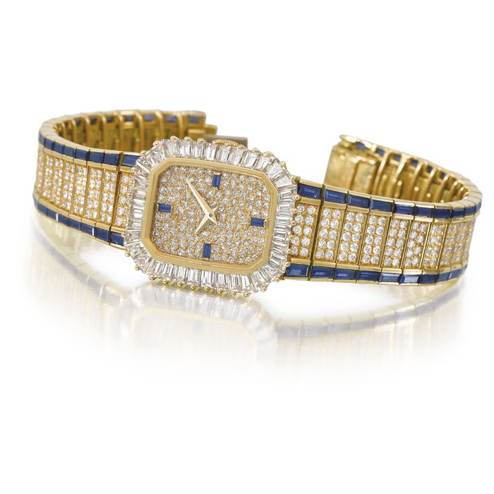 Patek Philippe. A highly attractiv and possibly unique 18K gold, diamond-set lady’s rectangular wristwatch with integral 18K gold, diamond and sapphire-set bracelet Signed Patek Philippe, Genève, ref. 4044/1, movement no. 1’410’456, case no. 2’817’778, manufactured in 1984