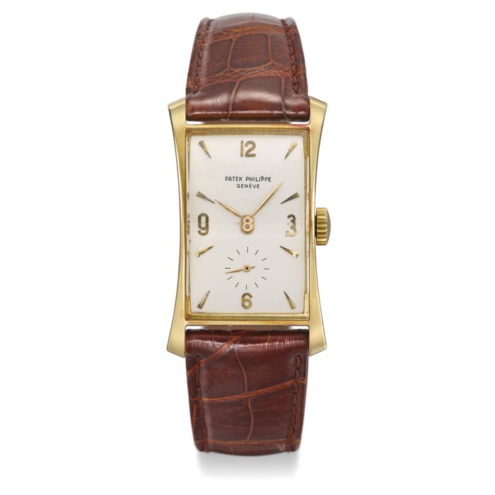 PATEK PHILIPPE. AN 18K GOLD RECTANGULAR CURVED WRISTWATCH SIGNED PATEK PHILIPPE, GENÈVE, REF. 1593, MOVEMENT NO. 973’240, CASE NO. 662’918, MANUFACTURED IN 1951