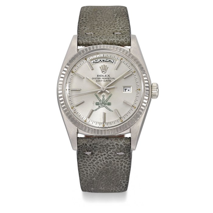 ROLEX. A VERY RARE 18K WHITE GOLD AUTOMATIC WRISTATCH WITH DAY, DATE AND GREEN KHANJAR SYMBOL, MADE FOR THE SULTANATE OF OMAN Signed Rolex, Oyster Perpetual, Day-Date, Ref. 1803, Case No. 3’520’994, Circa 1973