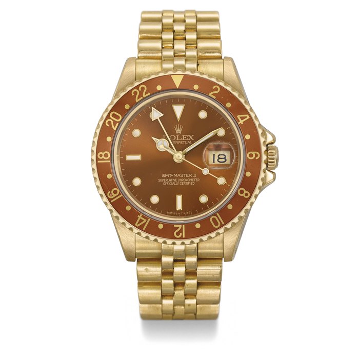 ROLEX. A FINE 18K GOLD AUTOMATIC DUAL TIME WRISTWATCH WITH SWEEP CENTRE SECONDS, DATE, COPPER-COLOURED DIAL AND BEZEL AND BRACELET SIGNED ROLEX, OYSTER PERPETUAL DATE, GMT-MASTER II, REF. 16718, CASE NO. L544181, CIRCA 1989