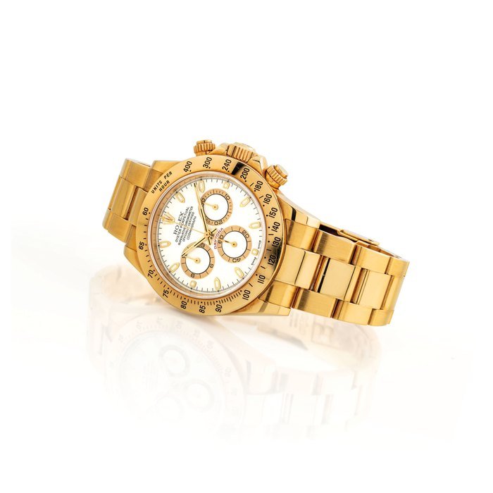 Rolex ROLEX. A FINE 18K GOLD AUTOMATIC CHRONOGRAPH WRISTWATCH WITH BRACELET AND IVORY-COLOURED DIAL SIGNED ROLEX, OYSTER PERPETUAL, COSMOGRAPH DAYTONA MODEL, REF. 116528, CASE NO. P954487, CIRCA 2000 · 116528