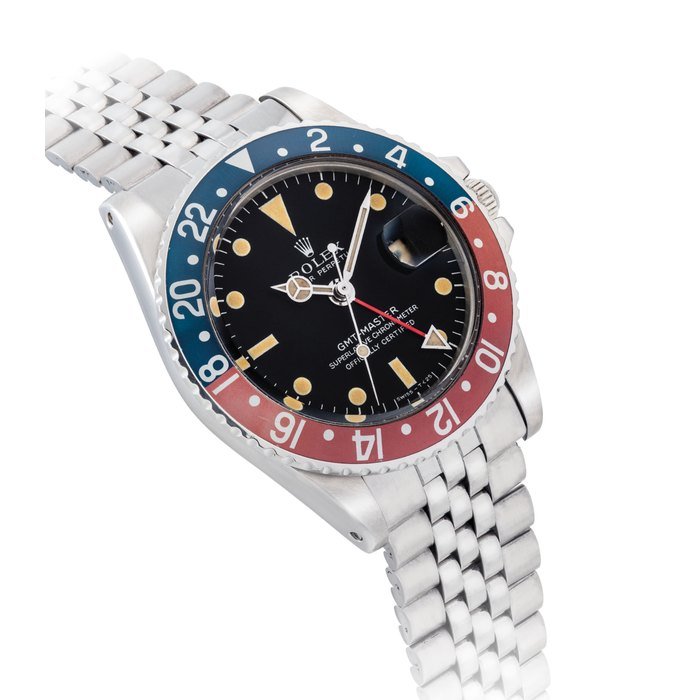 Rolex ROLEX. A RARE STAINLESS STEEL AUTOMATIC DUAL TIME WRISTWATCH WITH SWEEP CENTRE SECONDS, DATE AND BRACELET SIGNED ROLEX, OYSTER PERPETUAL, GMT-MASTER MODEL, REF. 1675, CASE NO. 2'110'207, CIRCA 1969 · 1675