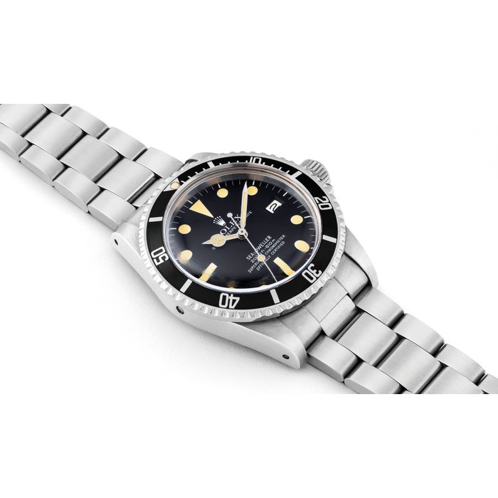 Rolex ROLEX. A FINE AND RARE STAINLESS STEEL AUTOMATIC WRISTWATCH WITH SWEEP CENTRE SECONDS, DATE, GAS ESCAPE VALVE AND BRACELET SIGNED ROLEX, OYSTER PERPETUAL DATE, SEA-DWELLER GREAT WHITE MODEL, REF. 1665, CASE NO. 6’014’674, CIRCA 1979, Price & Market Data