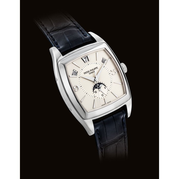 PATEK PHILIPPE. A FINE 18K WHITE GOLD CUSHION-SHAPED AUTOMATIC ANNUAL CALENDAR WRISTWATCH WITH SWEEP CENTRE SECONDS, MOON PHASES AND 24 HOUR INDICATION SIGNED PATEK PHILIPPE, REF. 5135, MOVEMENT NO. 3'422'299, CASE NO. 4'313'228, MANUFACTURED IN 2005