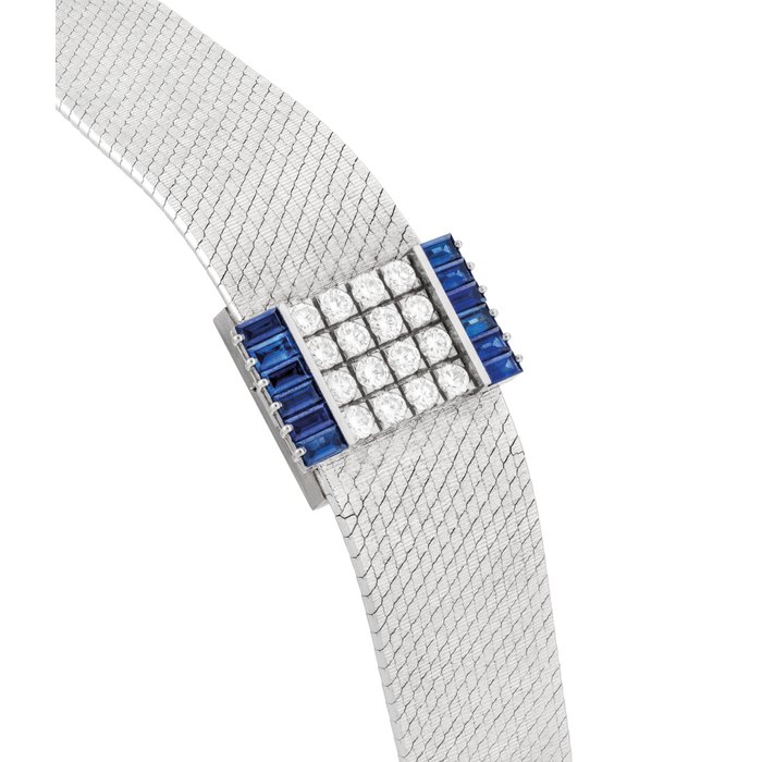 PATEK PHILIPPE. A LADY'S FINE, VERY RARE AND ELEGANT 18K WHITE GOLD, DIAMOND AND SAPPHIRE-SET RECTANGULAR BRACELET WATCH WITH CONCEALED DIAL SIGNED PATEK PHILIPPE, GENEVE, REF. 3319/4, MOVEMENT NO. 994'743, CASE NO. 2'690'718, MANUFACTURED IN 1976