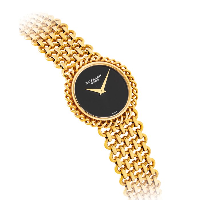 PATEK PHILIPPE. A LADY'S FINE AND ELEGANT 18K GOLD BRACELET WATCH WITH ONYX DIAL SIGNED PATEK PHILIPPE, REF. 4283, MOVEMENT NO. 1'397'906, CASE NO. 2'783'478, MANUFACTURED IN 1979