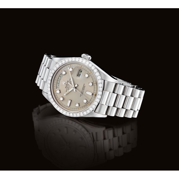 ROLEX. A RARE AND ATTRACTIVE PLATINUM AND DIAMOND-SET AUTOMATIC WRISTWATCH WITH SWEEP CENTRE SECONDS, DAY, DATE AND BRACELET SIGNED ROLEX, OYSTER PERPETUAL, DAY-DATE MODEL, REF. 1804, CASE NO. 5'028'307, CIRCA 1977