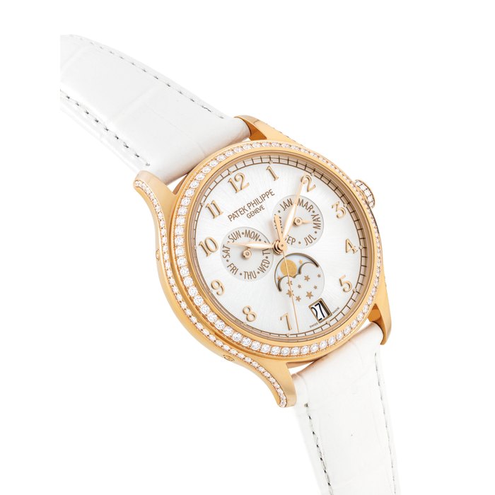 PATEK PHILIPPE. A LADY'S FINE 18K PINK GOLD AND DIAMOND-SET AUTOMATIC ANNUAL CALENDAR WRISTWATCH WITH SWEEP CENTRE SECONDS AND MOON PHASES SIGNED PATEK PHILIPPE, REF. 4947, MOVEMENT NO. 7'044'770, CASE NO. 6'186' 967, CIRCA 2017