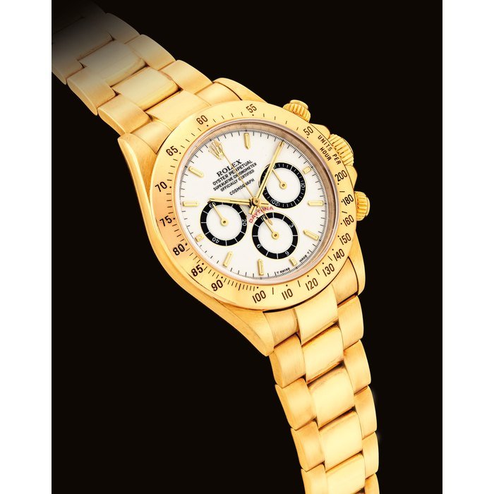 Rolex ROLEX. A VERY RARE AND FINE 18K GOLD AUTOMATIC CHRONOGRAPH WRISTWATCH WITH BRACELET AND PORCELAIN “ FLOATING ” COSMOGRAPH DIAL SIGNED ROLEX, OYSTER PERPETUAL, COSMOGRAPH DAYTONA MODEL, REF. 16528, CASE NO. R985336, CIRCA 1989 · 16528