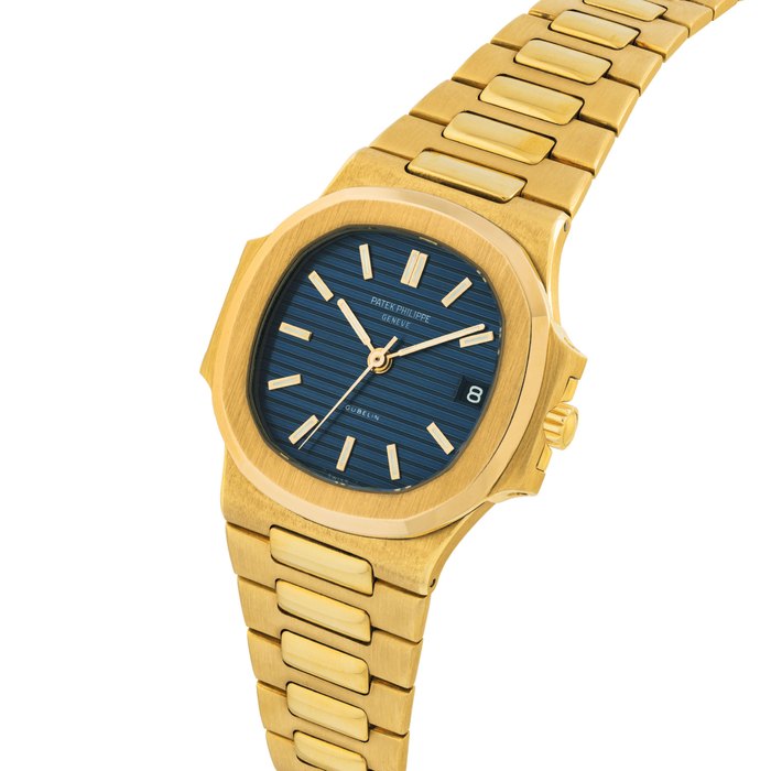 PATEK PHILIPPE. A FINE AND VERY RARE 18K GOLD AUTOMATIC WRISTWATCH WITH SWEEP CENTRE SECONDS, DATE AND BRACELET SIGNED PATEK PHILIPPE, GENEVE, RETAILED BY GÜBELIN, NAUTILUS MODEL, REF. 3800/1, MOVEMENT NO. 1’422’900, CASE NO. 2’803’839, MANUFACTURED IN 1983