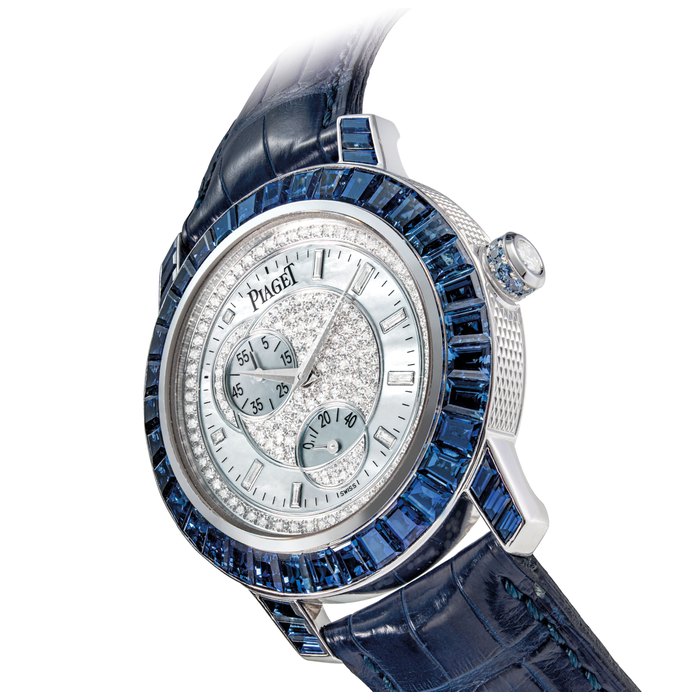 PIAGET. A RARE, FINE AND ATTRACTIVE 18K WHITE GOLD, SAPPHIRE AND DIAMOND-SET AUTOMATIC WRISTWATCH WITH POWER RESERVE AND MOTHER-OF-PEARL DIAL SIGNED PIAGET, AUTOMATIQUE, REF. P10144, CASE NO. 906'082, CIRCA 2000