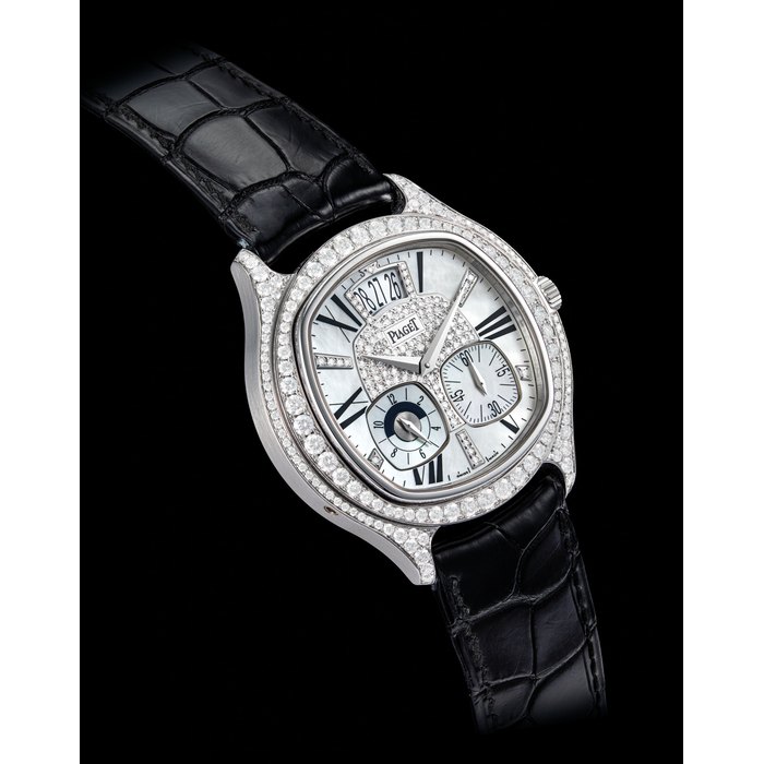 PIAGET. A FINE AND VERY RARE 18K WHITE GOLD AND DIAMOND-SET LIMITED EDITION AUTOMATIC DUAL TIME WRISTWATCH WITH DATE, DAY/NIGHT INDICATION AND MOTHER-OF-PEARL DIAL SIGNED PIAGET, EMPERADOR COUSSIN MODEL, NO. 26/50, REF. P10353, CASE NO. 955’025, CIRCA 2010