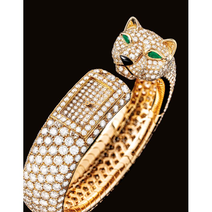 Cartier CARTIER. A LADY'S VERY FINE, RARE AND HIGHLY ATTRACTIVE 18K GOLD, DIAMOND, EMERALD AND ONYX-SET BANGLE WATCH SIGNED CARTIER, PARIS, PANTHERE MODEL, CASE NO. 702'402, CIRCA 2006, Price & Market Data