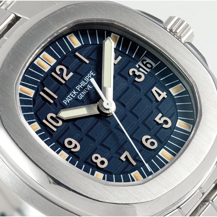 PATEK PHILIPPE. A FINE STAINLESS STEEL LIMITED EDITION CUSHION-SHAPED AUTOMATIC WRISTWATCH WITH SWEEP CENTRE SECONDS AND DATE, MADE FOR THE JAPANESE MARKET SIGNED PATEK PHILIPPE GENEVE, AQUANAUT MODEL, REF. 5066, MOVEMENT NO. 3'027'394, CASE NO. 4'055'355, MANUFACTURED IN 1999