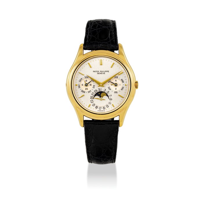 PATEK PHILIPPE. A FINE AND RARE 18K GOLD AUTOMATIC PERPETUAL CALENDAR WRISTWATCH WITH MOON PHASES, 24 HOUR AND LEAP YEAR INDICATION SIGNED PATEK PHILIPPE, GENEVE, REF. 3940, FIRST SERIES, MOVEMENT NO. 770'577, CASE NO. 2'838'568, MANUFACTURED IN 1987