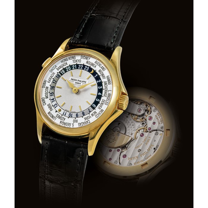 PATEK PHILIPPE. A FINE 18K GOLD AUTOMATIC WORLD TIME WRISTWATCH SIGNED PATEK PHILIPPE, REF. 5110, MOVEMENT NO. 3'211'647, CASE NO. 4'181'284, MANUFACTURED IN 2003