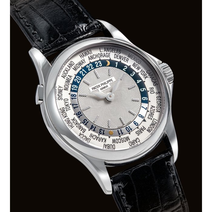 PATEK PHILIPPE. A FINE 18K WHITE GOLD AUTOMATIC WORLD TIME WRISTWATCH SIGNED PATEK PHILIPPE, REF. 5110, MOVEMENT NO. 3'208’280, CASE NO. 4'142’ 037, MANUFACTURED IN 2001