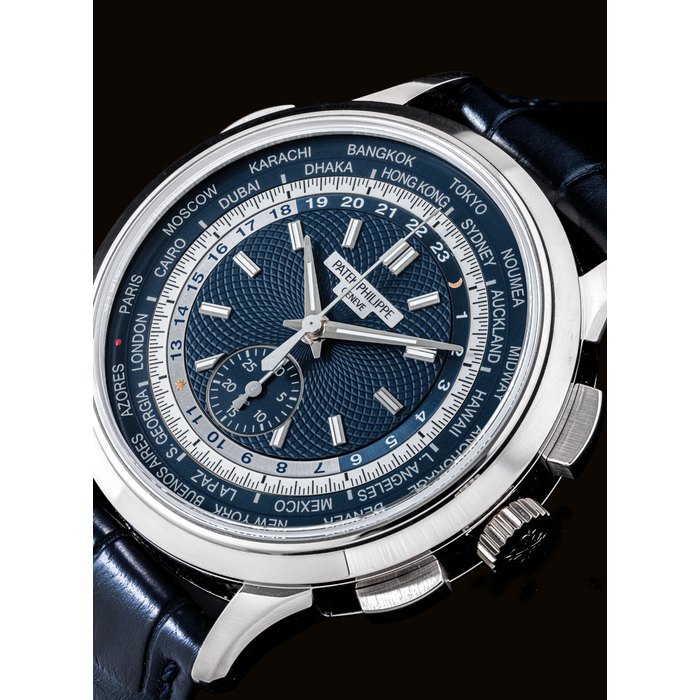PATEK PHILIPPE. A FINE AND RARE 18K WHITE GOLD AUTOMATIC FLYBACK CHRONOGRAPH WRISTWATCH WITH WORLDTIME DISPLAY SIGNED PATEK PHILIPPE, GENEVE, REF. 5930, MOVEMENT NO. 7'039'610, CASE NO. 6'173'921, CIRCA 2017