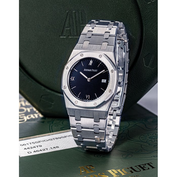 AUDEMARS PIGUET. A STAINLESS STEEL AND PLATINUM WRISTWATCH WITH DATE AND BRACELET SIGNED AUDEMARS PIGUET, ROYAL OAK, NO.148, CASE NO. D46427, CIRCA 2005