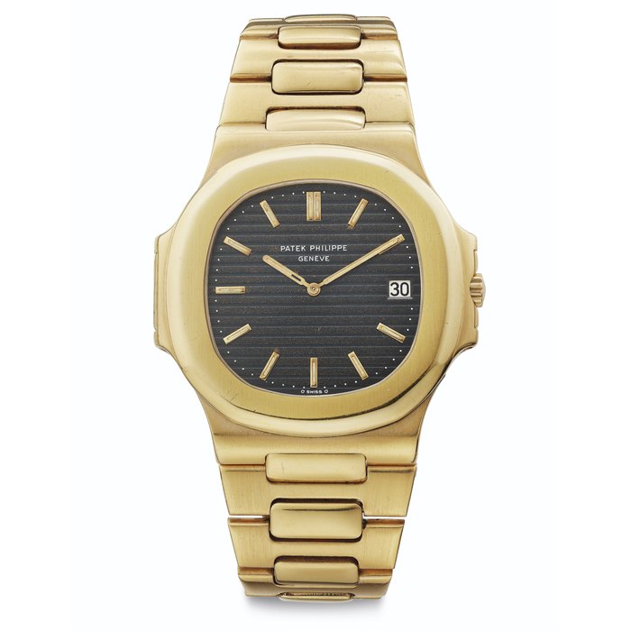 Patek Philippe. A Fine 18k Gold Automatic Wristwatch with Date, Bracelet and Light "Tropical Dial" Signed Patek Philippe, Genève, Nautilus Model, Ref. 3700, Movement No. 1'304'366, Case No. 536'070, Manufactured in 1977