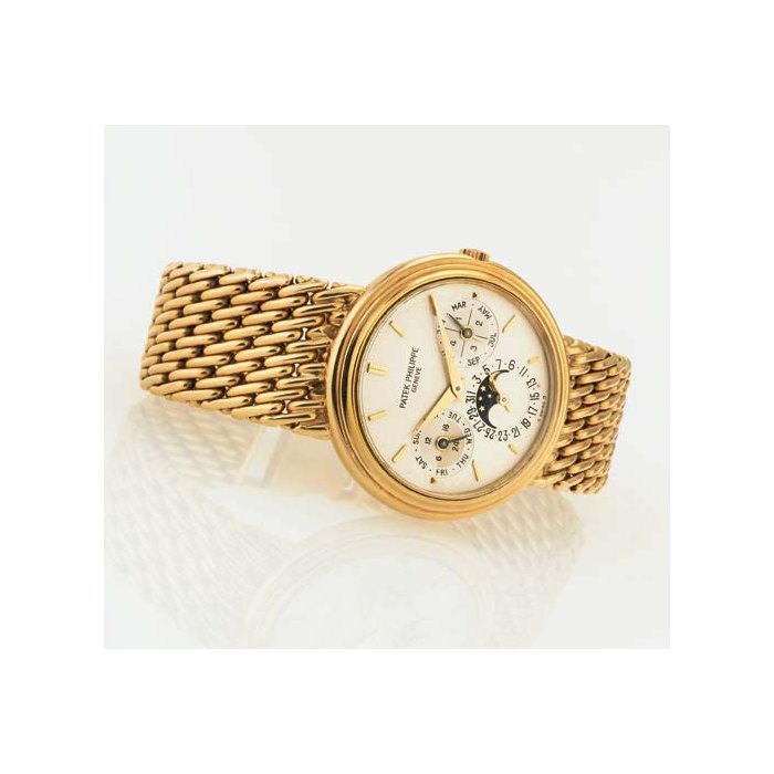 PATEK PHILIPPE. AN 18K GOLD AUTOMATIC PERPETUAL CALENDAR BRACELET WATCH WITH MOON PHASES SIGNED PATEK PHILIPPE, GENEVE, MOVEMENT NO. 771533, CASE NO. 2856685, REF. 3945/1, CIRCA 1993
