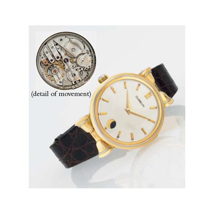 GÜBELIN. AN UNUSUAL AND UNIQUE 18K GOLD AND PLATINUM LEFT-HANDED MINUTE REPEATING WRISTWATCH WITH MOON PHASES SIGNED GÜBELIN, MOVEMENT AND CASE NO. 224855, REF. 1987, CIRCA 1985