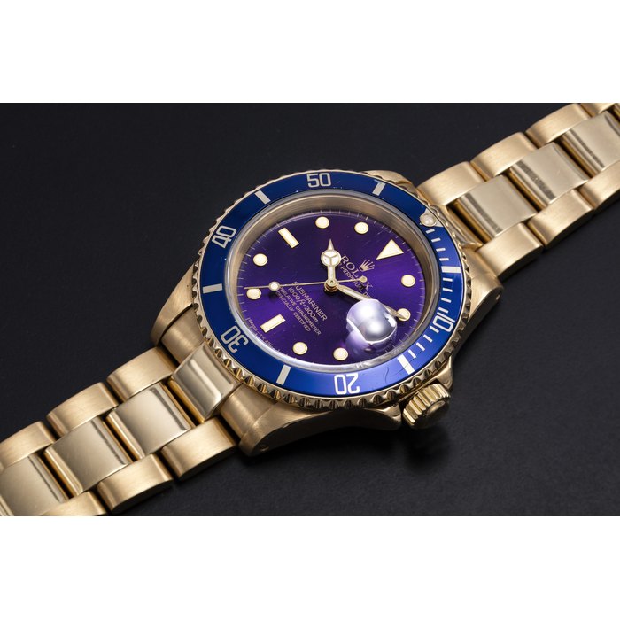 ROLEX, A YELLOW GOLD SUBMARINER WITH PURPLE DIAL, REF. 16618 CASE NUMBER E379’668, MOVEMENT NUMBER: 5671642