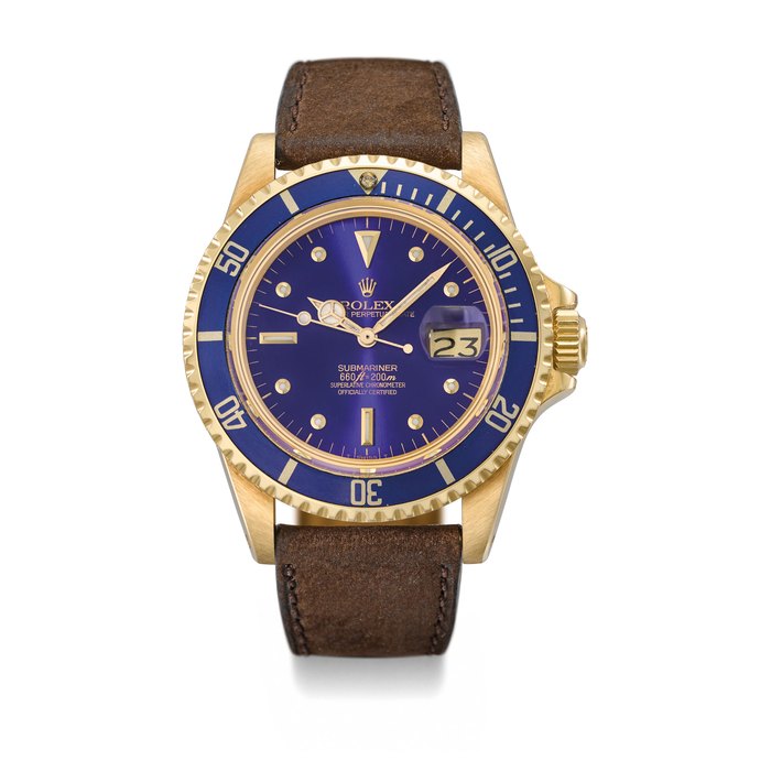 Rolex. A very attractive 18K gold automatic wristwatch with sweep centre seconds, date and colour change blue dial Signed Rolex, Oyster Perpetual Date, Submariner, 660ft=200m, ref. 1680, case no. 5’909’215, circa 1979