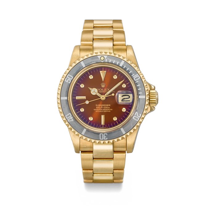 ROLEX. A VERY RARE AND FINE 18K GOLD AUTOMATIC WRISTWATCH WITH SWEEP CENTRE SECONDS, DATE, TROPICAL DIAL AND BRACELET SIGNED ROLEX, OYSTER PERPETUAL DATE, SUBMARINER, REF. 1680, CASE NO. 5’861’278, CIRCA 1978