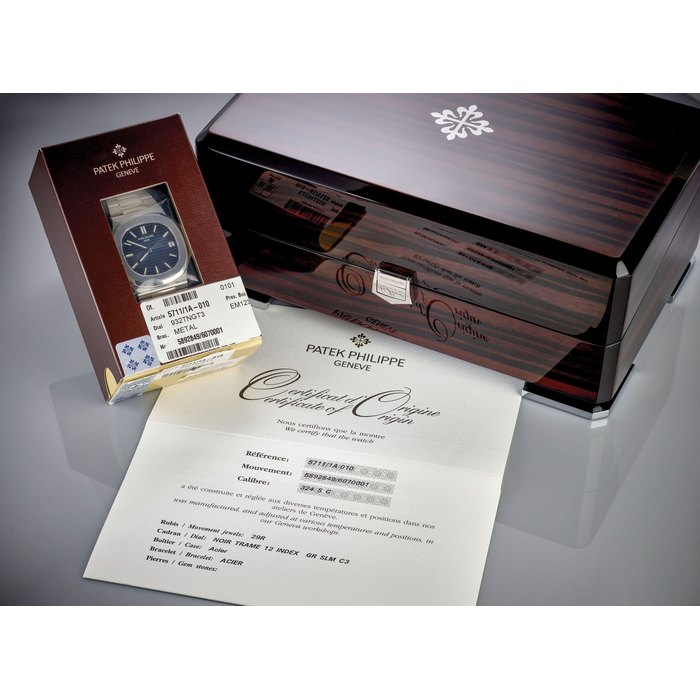 PATEK PHILIPPE. A VERY FINE STAINLESS STEEL AUTOMATIC WRISTWATCH WITH SWEEP CENTRE SECONDS, DATE, BRACELET, ORIGINAL CERTIFICATE AND BOX Signed Patek Philippe, Genève, Nautilus Model, Ref. 5711/1A-010, Movement No. 5’892’849, Case No. 6’070’001, Circa 2015