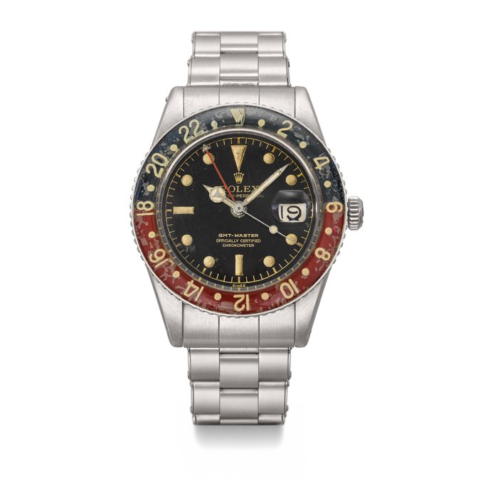 ROLEX. A VERY RARE STAINLESS STEEL DUAL TIME AUTOMATIC WRISTWATCH WITH SWEEP CENTRE SECONDS, DATE, BLACK GLOSS “SPIDER” DIAL, BAKELITE BEZEL AND BRACELET SIGNED ROLEX, OYSTER PERPETUAL, GMT-MASTER, REF. 6542, CASE NO. 381’793, CIRCA 1958