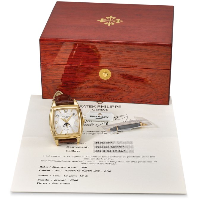 Patek Philippe. A fine 18K gold cushion-shaped automatic annual calendar wristwatch with sweep centre seconds, moon phases, 24-hour indication, original certificate, sales tag and box Signed Patek Philippe, Gondolo Calendario model, ref. 5135J, movement no. 3'422'030, case no. 4'290'151, manufactured in 2005