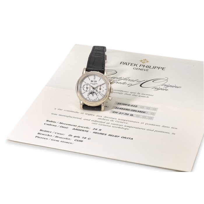 Patek Philippe. A very fine and rare 18K white gold perpetual calendar chronograph wristwatch with moon phases, 24 hour and leap year indication, additional case back and original certificate Signed Patek Philippe, Genève, ref. 3970EG-022, movement no. 3’045’890, case no. 2’953’400, manufactured in 1999