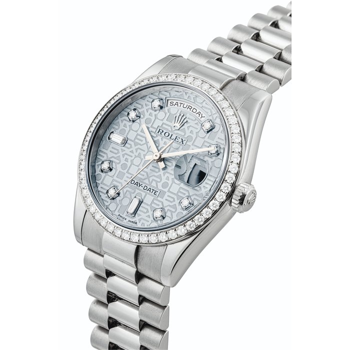ROLEX. A PLATINUM AND DIAMOND-SET AUTOMATIC WRISTWATCH WITH SWEEP CENTRE SECONDS, DAY, DATE AND BRACELET SIGNED ROLEX, OYSTER PERPETUAL, DAY-DATE MODEL, REF. 118346, CASE NO. K560602, CIRCA 2001