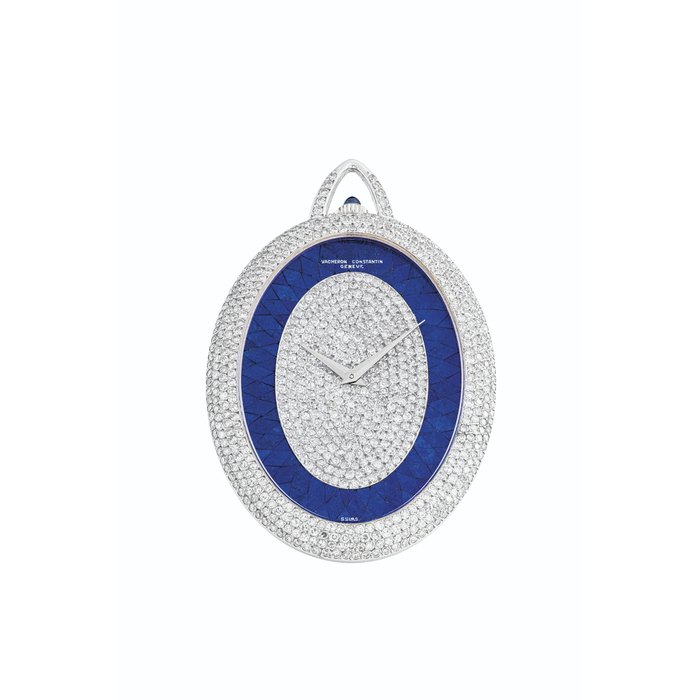 VACHERON CONSTANTIN. A POSSIBLY UNIQUE AND MAGNIFICENT AND VERY RARE 18K WHITE GOLD AND DIAMOND-SET KEYLESS LEVER OVAL PENDANT WATCH WITH LAPIS LAZULI DIAL SIGNED VACHERON CONSTANTIN, GENEVE, REF. 53701, MOVEMENT NO. 633'473, CASE NO.513'282, MANUFACTURED IN 1977