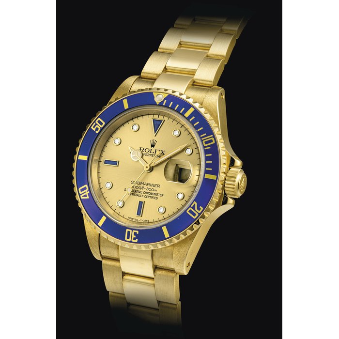 ROLEX. AN ATTRACTIVE 18K GOLD, DIAMOND AND SAPPHIRE-SET AUTOMATIC WRISTWATCH WITH SWEEP CENTRE SECONDS, DATE, BRACELET AND CHAMPAGNE DIAL SIGNED ROLEX, OYSTER PERPETUAL DATE, SUBMARINER MODEL, REF. 16618, CASE. L874644, CIRCA 1989