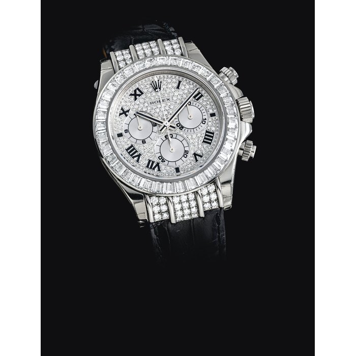 ROLEX. A RARE AND IMPRESSIVE 18K WHITE GOLD AND DIAMOND-SET AUTOMATIC CHRONOGRAPH WRISTWATCH SIGNED ROLEX, OYSTER PERPETUAL, DAYTONA MODEL, REF. 116599TBR, CASE NO. K588566, CIRCA 2005