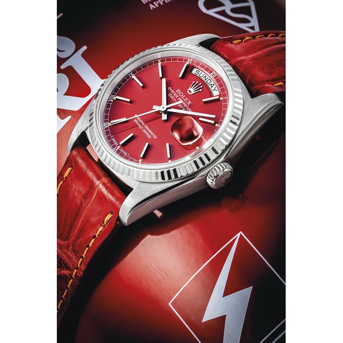 ROLEX. A RARE AND ATTRACTIVE 18K WHITE GOLD AUTOMATIC WRISTWATCH WITH SWEEP CENTRE SECONDS, DAY, DATE AND RED LACQUERED "STELLA" DIAL SIGNED ROLEX, OYSTER PERPETUAL, DAY-DATE MODEL, REF. 18039, CASE NO. 5'257'887, CIRCA 1978