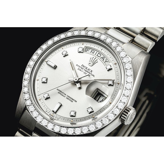 ROLEX. A VERY RARE 18K WHITE GOLD AND DIAMOND-SET AUTOMATIC WRISTWATCH WITH SWEEP CENTRE SECONDS, DAY, DATE, AND BRACELET SIGNED ROLEX, OYSTER PERPETUAL, DAY-DATE MODEL, REF. 1804, CASE NO. 3'940'673, CIRCA 1975