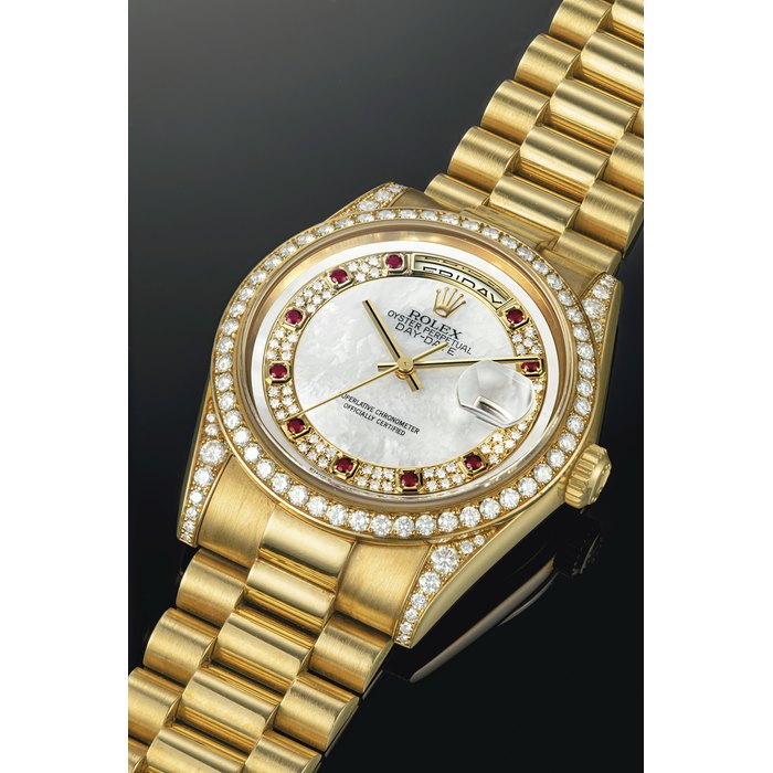 ROLEX. A RARE 18K GOLD, DIAMOND AND RUBY-SET AUTOMATIC WRISTWATCH WITH SWEEP CENTRE SECONDS, DAY, DATE, BRACELET AND MOTHER-OF-PEARL DIAL SIGNED ROLEX, OYSTER PERPETUAL, DAY-DATE MODEL, REF. 118388, CASE NO. P906547, CIRCA 2000