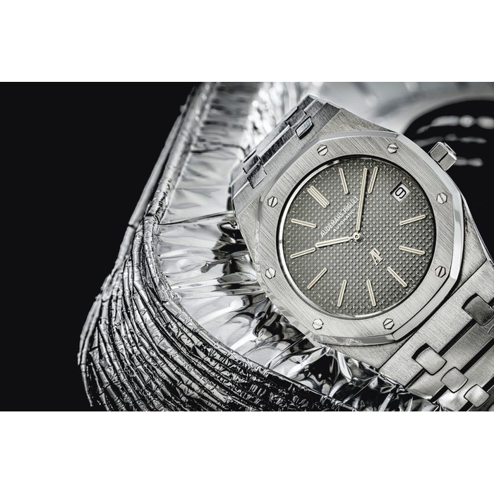 AUDEMARS PIGUET. A VERY RARE AND HIGHLY ATTRACTIVE STAINLESS STEEL AUTOMATIC WRISTWATCH WITH DATE AND BRACELET SIGNED AUDEMARS PIGUET, ROYAL OAK A-SERIES MODEL, REF. 5402ST, NO. A1347, MOVEMENT NO. 138'705, CASE NO. 80'347, CIRCA 1974