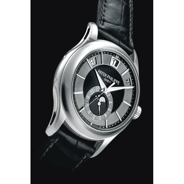 PATEK PHILIPPE. AN 18K WHITE GOLD AUTOMATIC ANNUAL CALENDAR WRISTWATCH WITH SWEEP CENTRE SECONDS, MOONPHASES AND 24 HOUR INDICATION SIGNED PATEK PHILIPPE, REF. 5205, MOVEMENT NO. 5'672'337, CASE NO. 4'603'330, CIRCA 2013