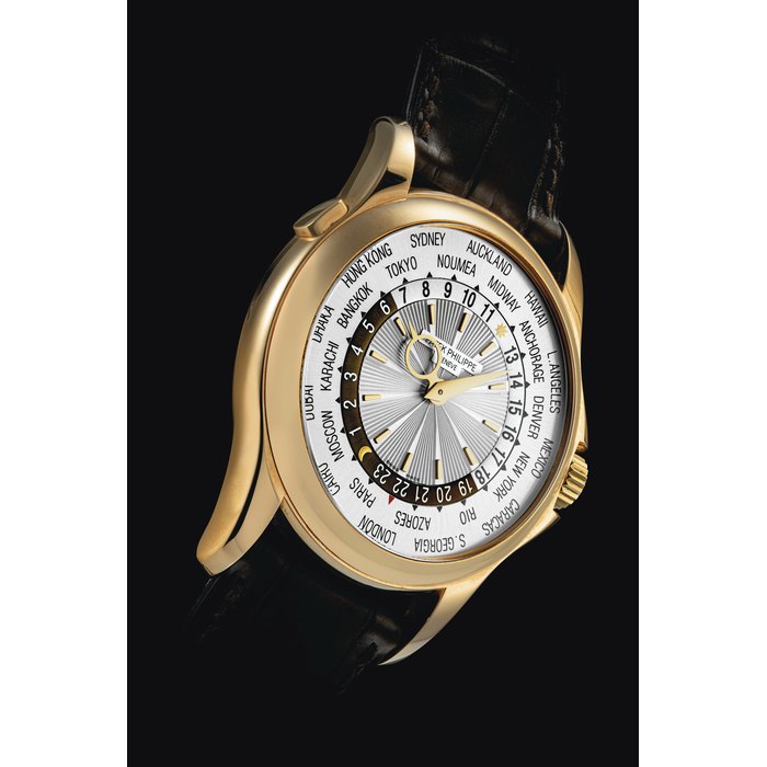 PATEK PHILIPPE. AN 18K PINK GOLD AUTOMATIC WORLD TIME WRISTWATCH SIGNED PATEK PHILIPPE, REF. 5130, MOVEMENT NO. 3'671'113, CASE NO. 4'437'347, MANUFACTURED IN 2007