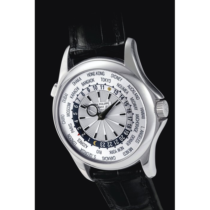 PATEK PHILIPPE. AN 18K WHITE GOLD AUTOMATIC WORLD TIME WRISTWATCH SIGNED PATEK PHILIPPE, REF. 5130, MOVEMENT NO. 3'640'801, CASE NO. 4'435'324, MANUFACTURED IN 2007