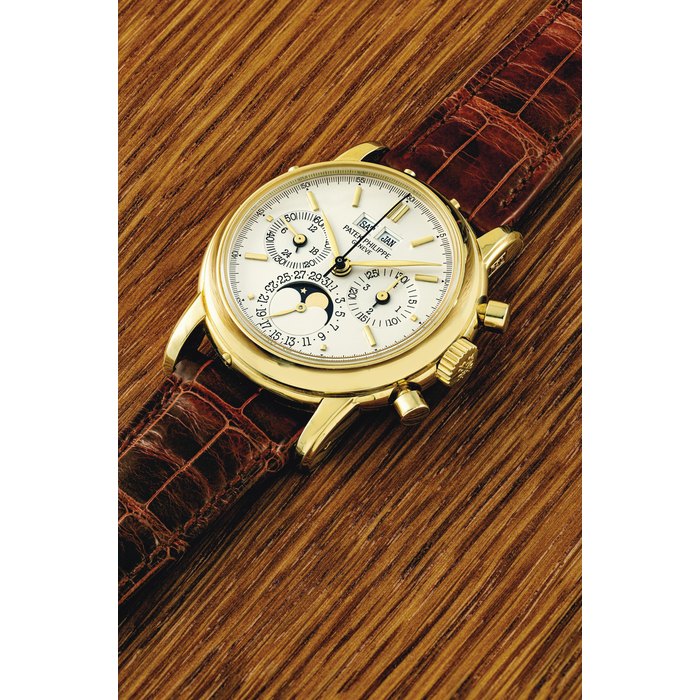 PATEK PHILIPPE. AN 18K GOLD PERPETUAL CALENDAR CHRONOGRAPH WRISTWATCH WITH MOON PHASES, 24 HOUR AND LEAP YEAR INDICATION SIGNED PATEK PHILIPPE, GENEVE, REF. 3970E, MOVEMENT NO. 875'864, CASE NO. 2'896'058, MANUFACTURED IN 1991